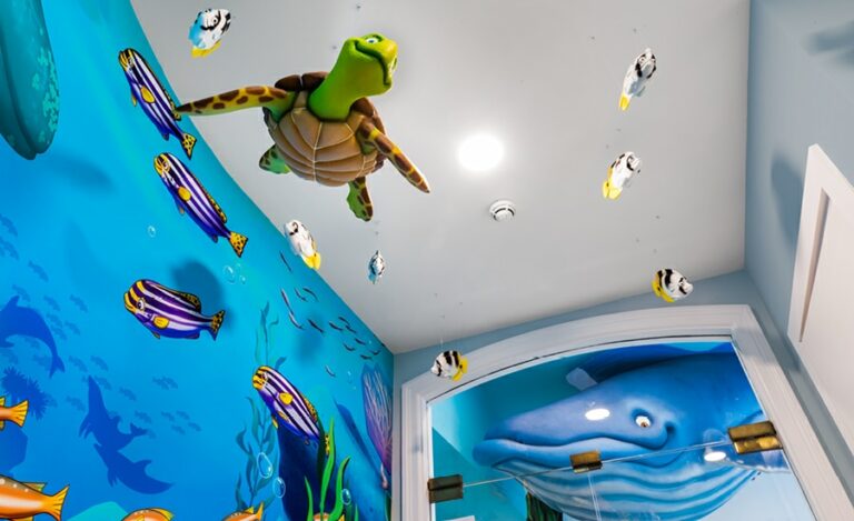 3d turtle and fish sculptures suspended from entranceway ceiling