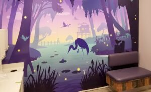Calming bayou silhouette mural with purple, blue, and yellow tones