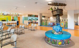 community medical clinic waiting room with underwater shipwreck themed reception desk