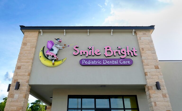 Dental office external building signage with a custom sculpted cow character