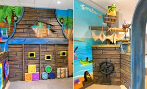 Game tablets and play panels on a custom pirate ship wall with pirate turtle and parrot characters in waiting room