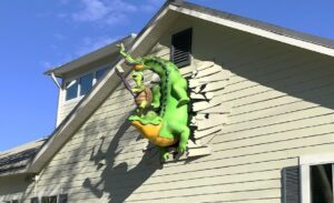 Giant sculpted alligator, turtle and frog "bust out" serve as an exterior landmark for a pediatric dental practice