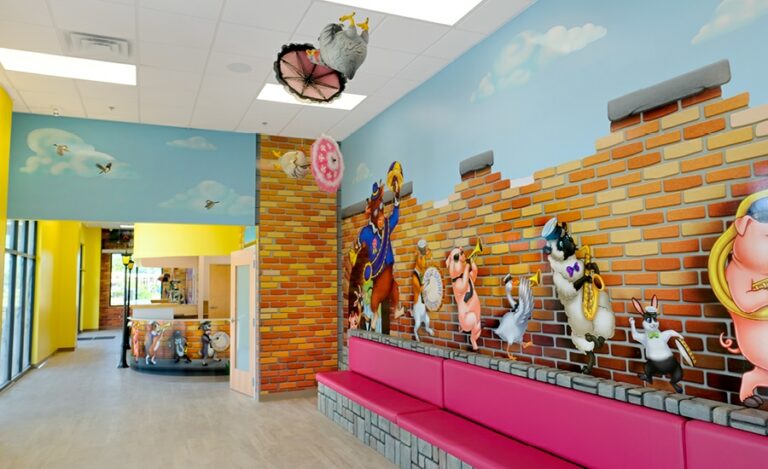 dental office wait room with colorful mardi gras wall murals and custom sculpted benches