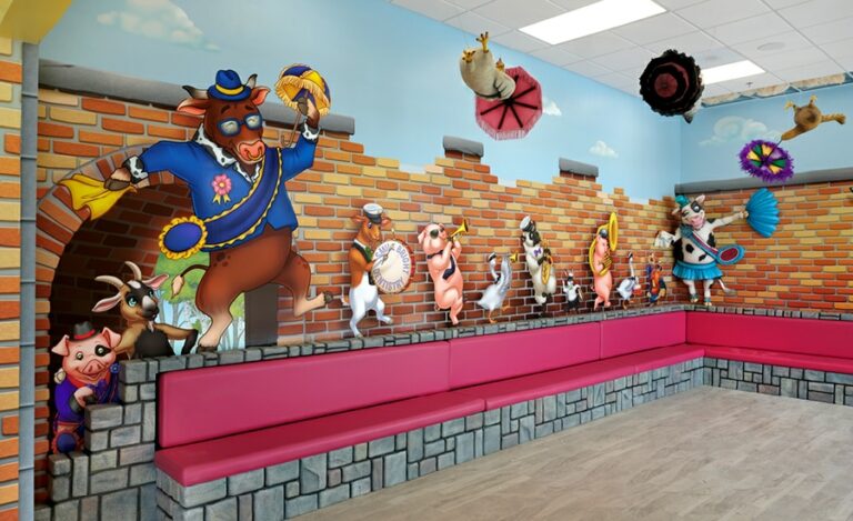 custom musical wall murals, clad benches and cow photo op in a dental office waiting room
