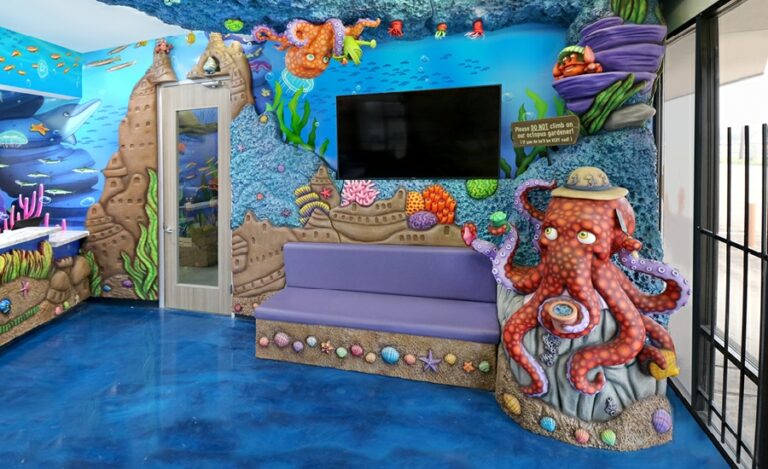 custom bench with a friendly octopus gardener character and underwater sand castle cladding