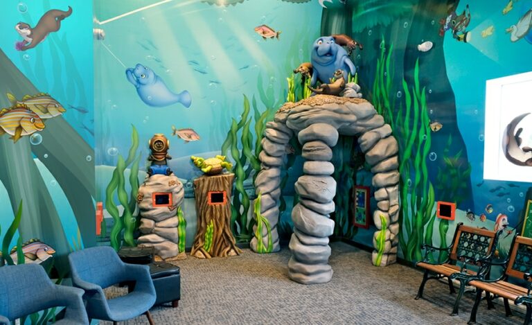 Amazing river themed gaming area in pediatric dental office waiting room