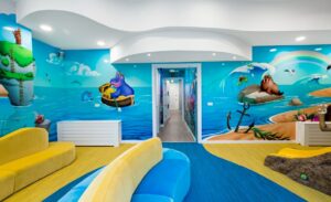 beach themed wall murals in kids waiting room play area