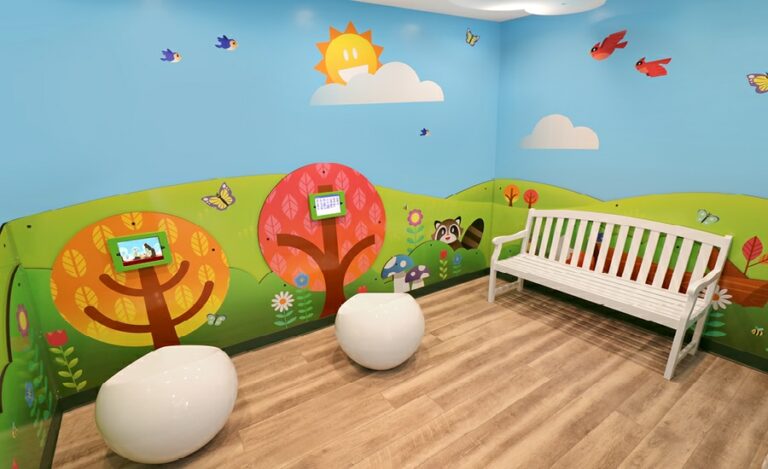 contemporary kids murals and gaming tablets in kids play area