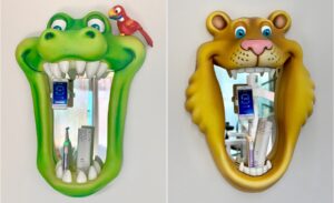 crocodile and lion brushing mirrors in kid friendly dental office