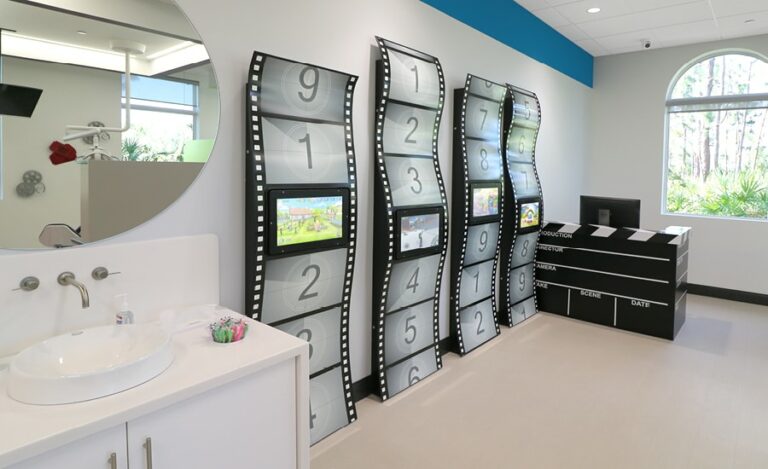 custom touch screen gaming on film strip sculptures in kids dentist office