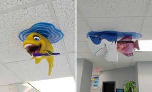 cute fish sculptures on ceiling of pediatric dental treatment bay