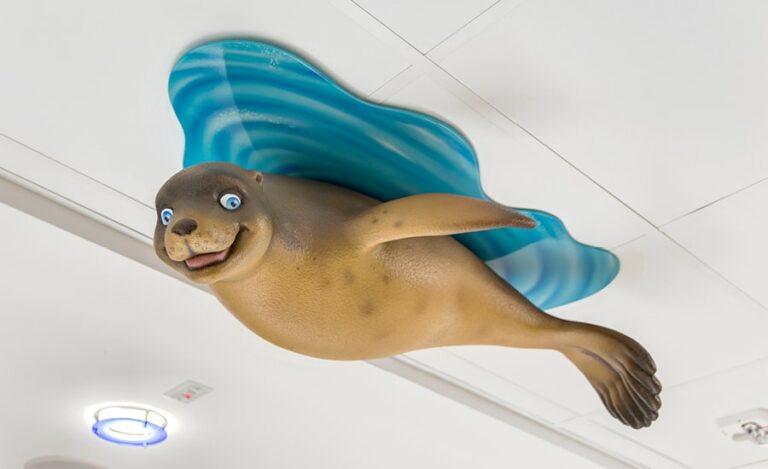 cute seal sculpture mounted on medical room ceiling