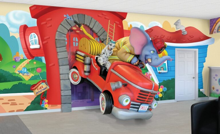 Fire truck sculpture with elephant firefighter and dalmatian in pediatric waiting room
