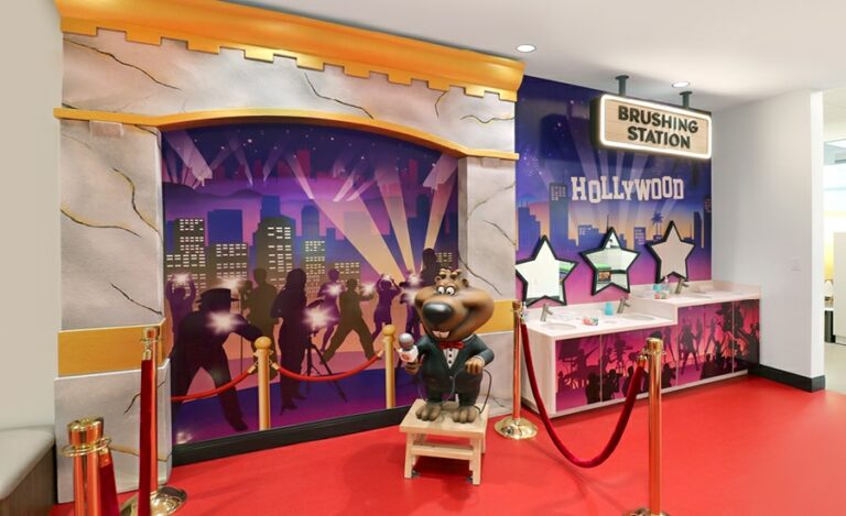 Hollywood themed brushing station with custom red carpet murals and beaver character
