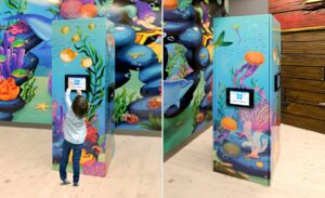 kids game tower with an underwater mural in an ocean themed pediatric office