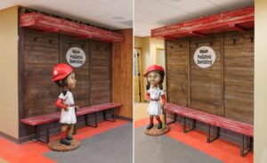 little girl baseball player sculpture and dugout themed bench at dentist office