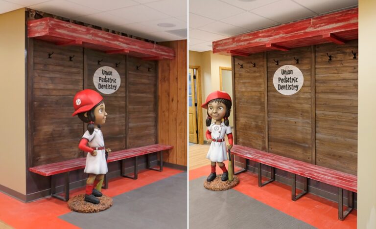 little girl baseball player sculpture and dugout themed bench at dentist office