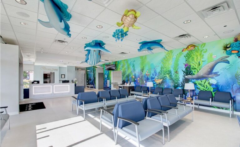 medical waiting room with underwater murals and sculptures