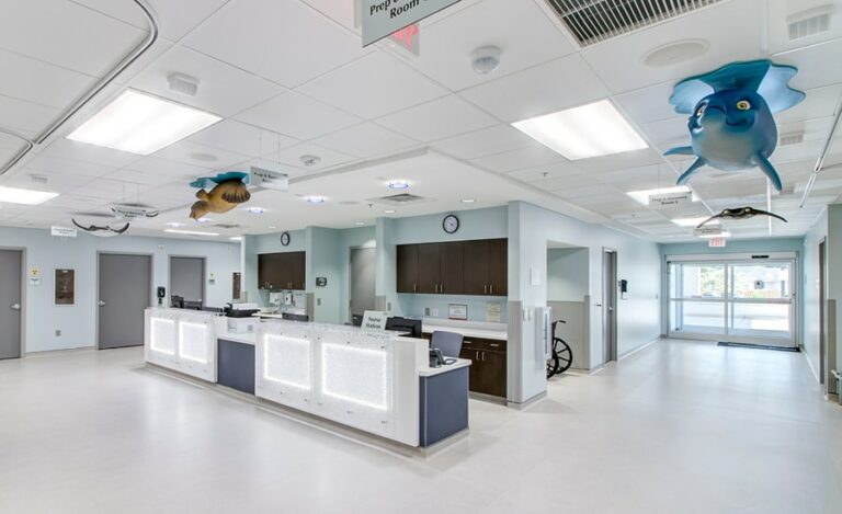 nurse station with sculpted aquatic animal characters suspended from ceiling