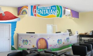 Reception desk with murals in pediatric waiting room