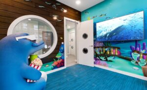 underwater themed wall murals in kids theater in dentist office