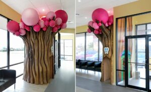 Whimsical pink tree in kids waiting room