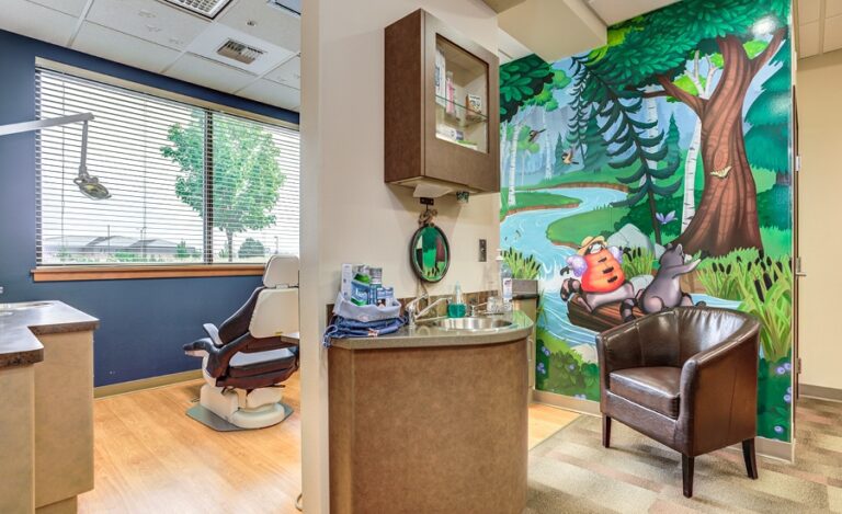 Kid friendly forest themed wall mural in a dental treatment room.