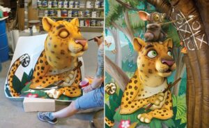 artist painting surprised cheetah sculpture