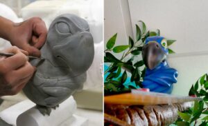 artist sculpting angry parrot