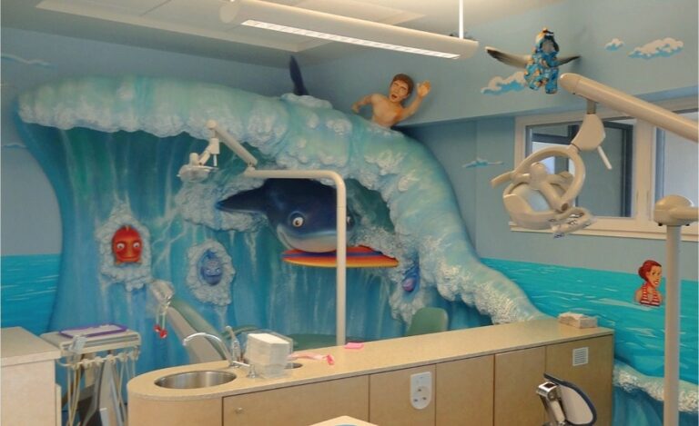 beach themed dental treatment room with sculpted surf wave and shark