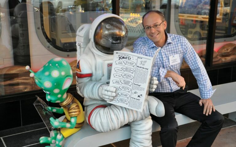 Photo op bench featuring an astronaut and an alien character.