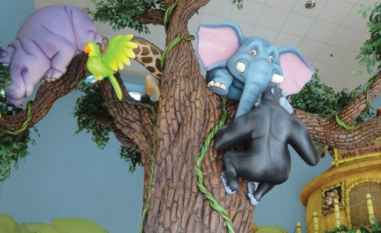 large sculpted tree with jungle jungle animal sculptures in the branches