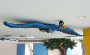 blue sculpted birds in cafeteria of childrens medical clinic