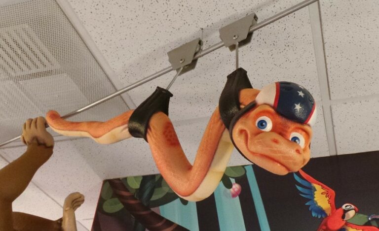 bright ziplining sculpted snake close up for a jungle themed pediatric office