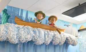 canoeing characters on sculpted wave above a pediatric treatment area