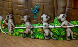 closeup of meerkat characters on reception desk for a pediatric dentist office