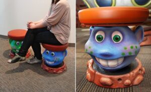 custom alien shaped stools in a space themed dental office