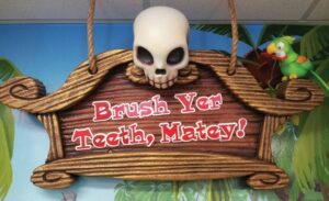 custom pirate sign for kids brushing station that says 'brush your teeth, matey!'