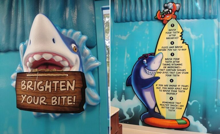 custom signage for a kids dentistry with fun dental tips and friendly sculpted shark characters