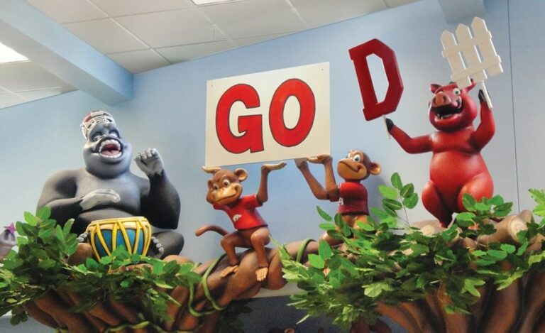 custom sports themed jungle animals on top of entrance ways in a pediatric office