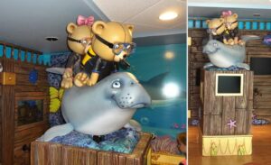 custom teddy bear sculptures in scuba gear riding a seal in pediatric dental office