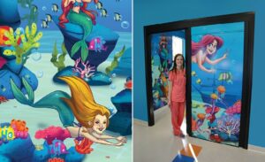custom undersea mural with mermaid caricatures for pediatric treatment room