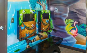 custom wall mounted gaming consoles with tropical theming for a pediatric office
