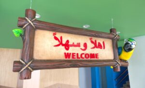 custom welcome sign with parrot character