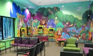 custom whimsical jungle murals in kids doctor's office waiting room