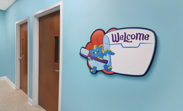 custom whiteboard sign with dragon character in pediatric office