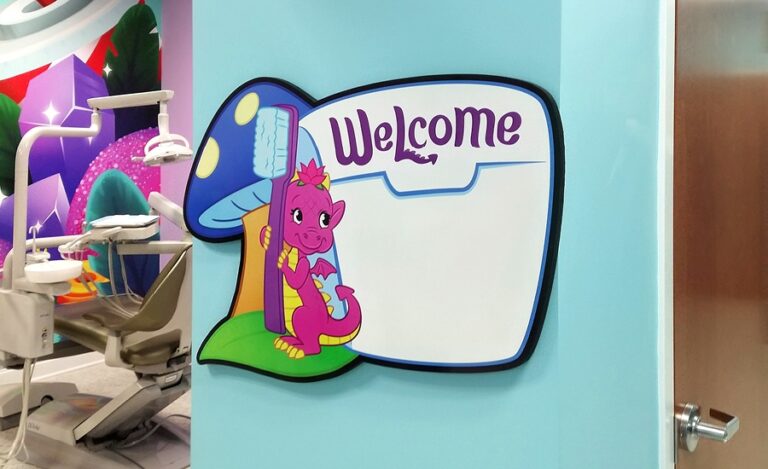 custom whiteboard signage with dragon character for pediatric dental office
