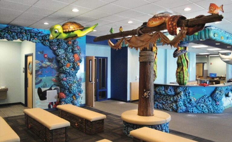 dental office waiting area with custom seating designed like coral and treasure chests