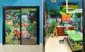dental treatment room with doorway graphics and wall murals with tropical jungle scenery