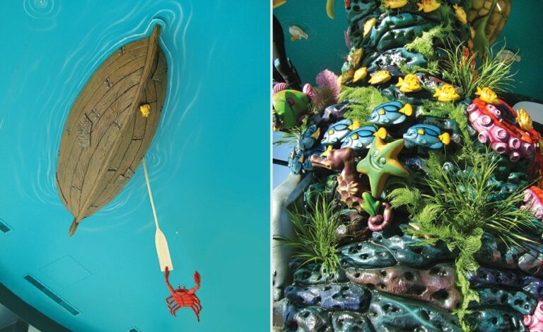 detail of custom boat sculpture and coral reef with fish